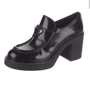 Prada enameled metal triangle leather oxfords